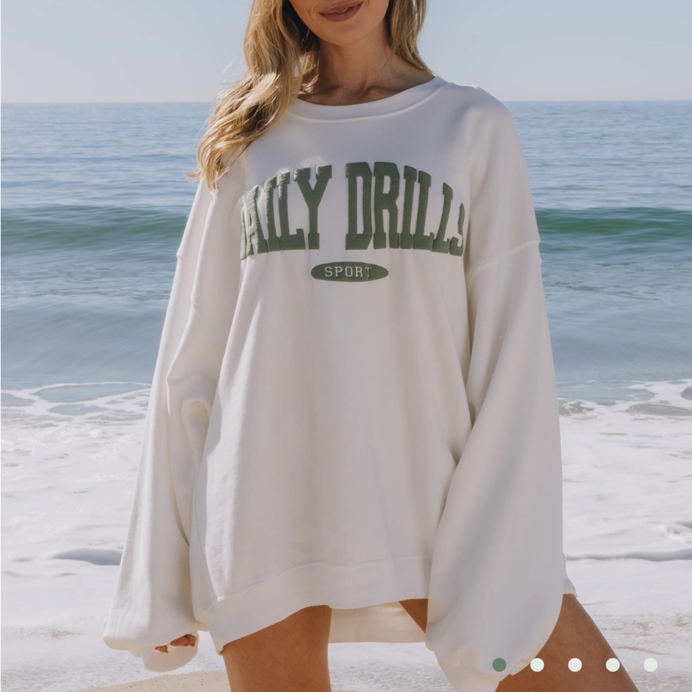 Daily Drills Women's Cream Sweatshirt with Green Logo